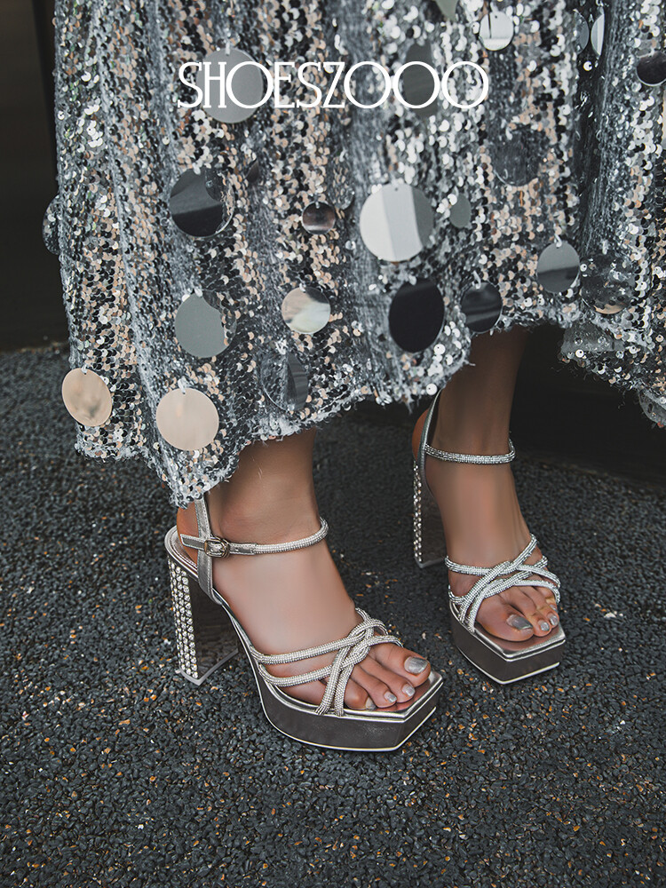 Rhinestone embellished high-heeled sandals.