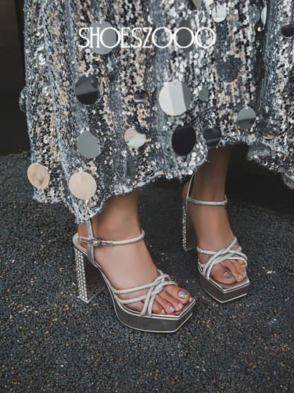 Rhinestone embellished high-heeled sandals.
