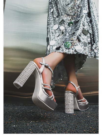 Rhinestone embellished high-heeled sandals.
