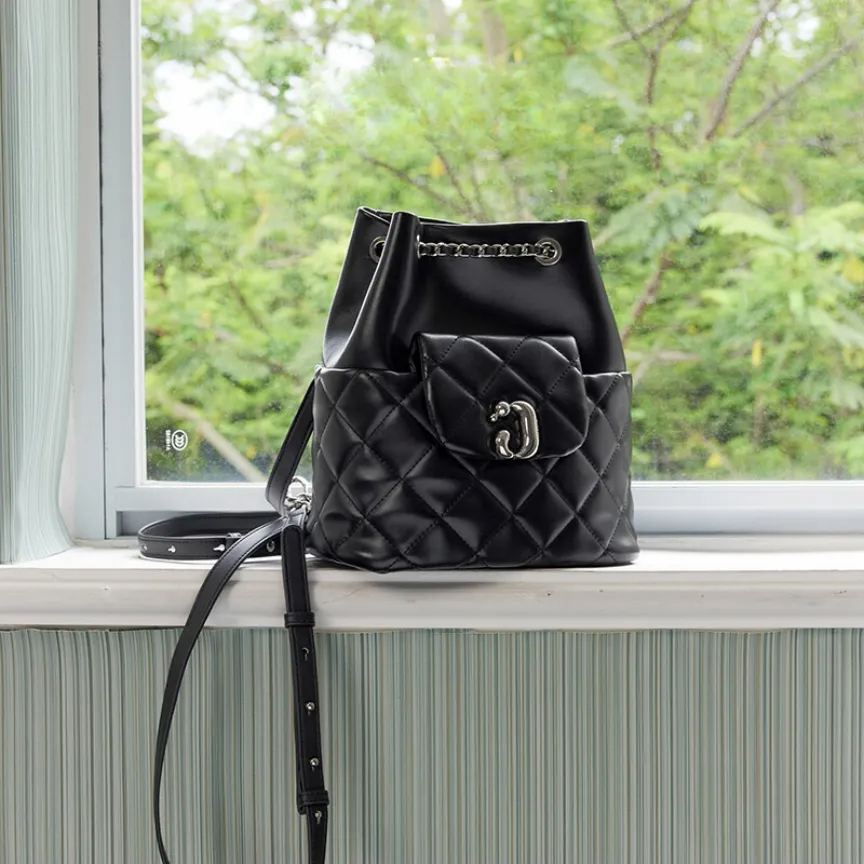 Cowhide Quilted Drawstring Backpack