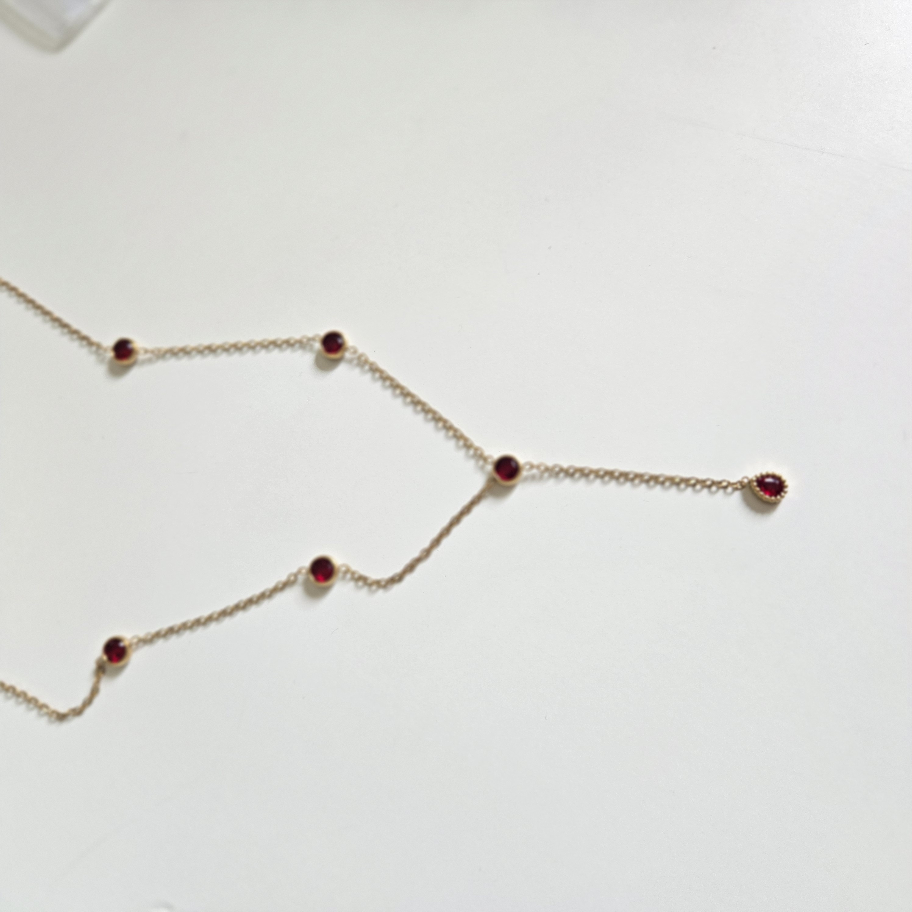 RED ZIRCON LARIAT NECKLACE GOLD