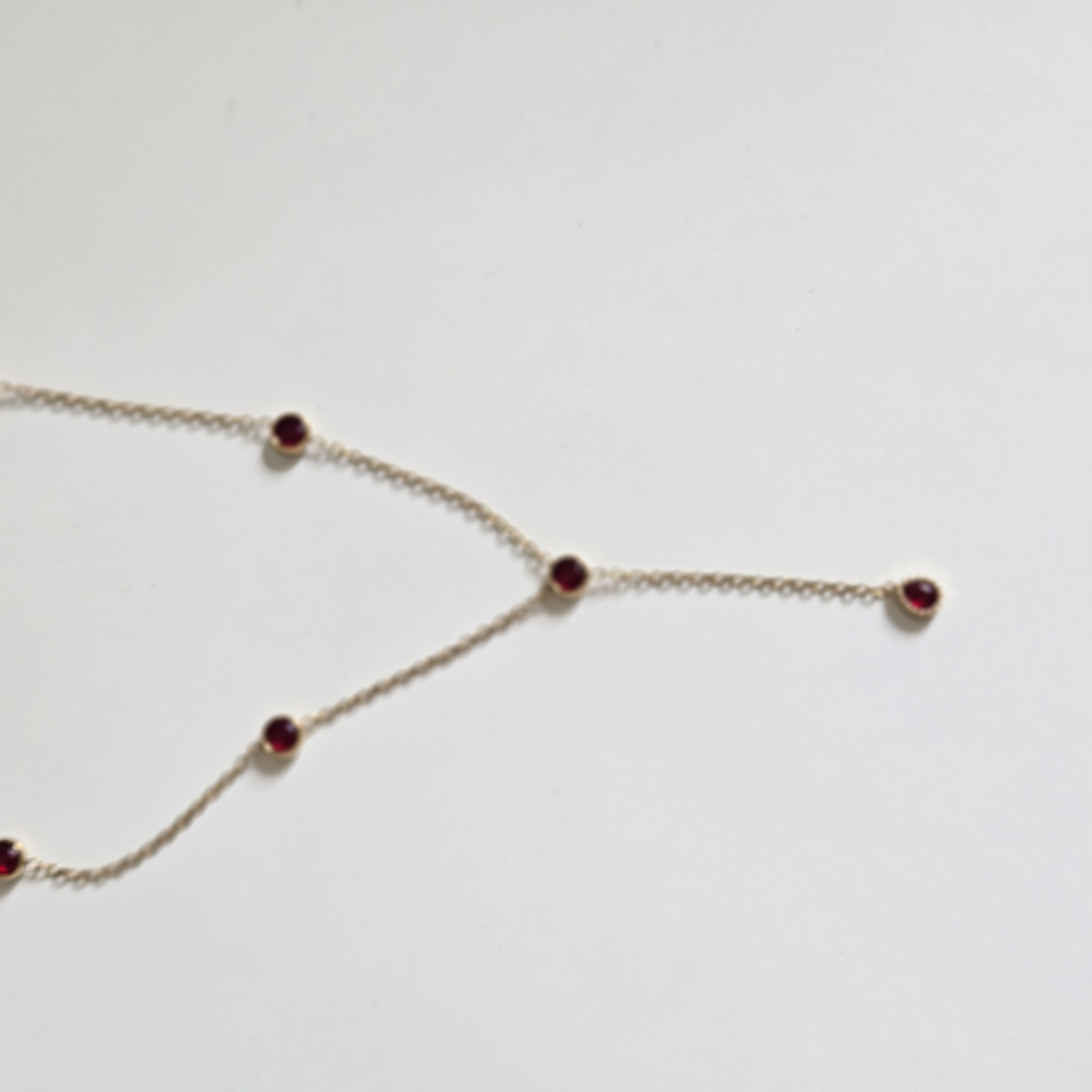 RED ZIRCON LARIAT NECKLACE GOLD