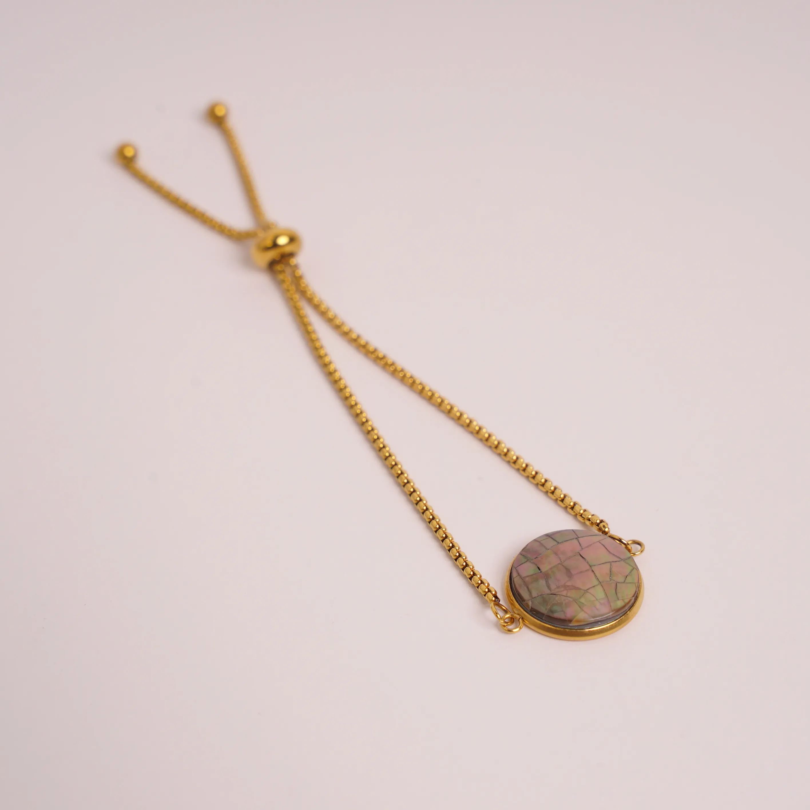 MOTHER OF PEARL BLACK SLIDE BRACELET GOLD