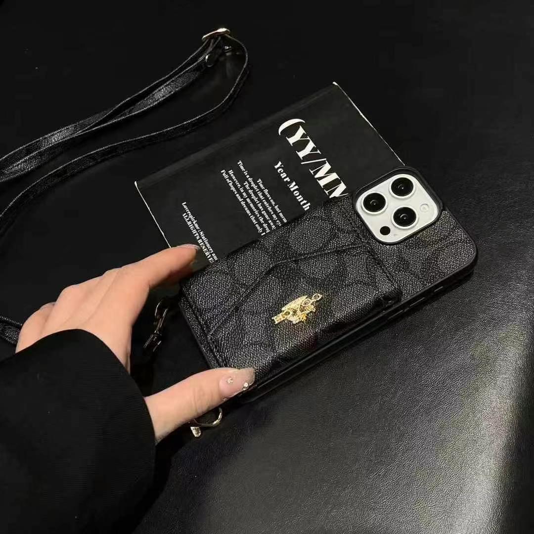 Coach手風琴款黑邊手機卡包(帶背帶)-美觀與使用結合! 專櫃皮質製作,不與地攤貨比較!