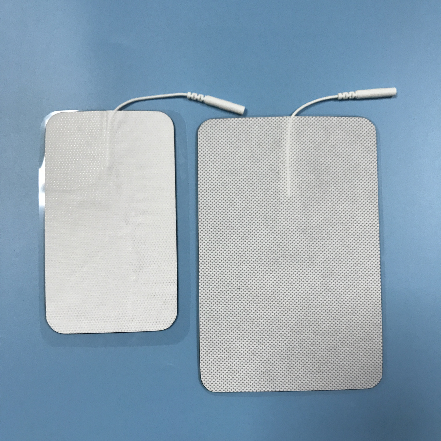 Wholesale 2.0/2.5mm tail fiber TENS, self-adhesive physical therapy, electrode pads for electrotherapy