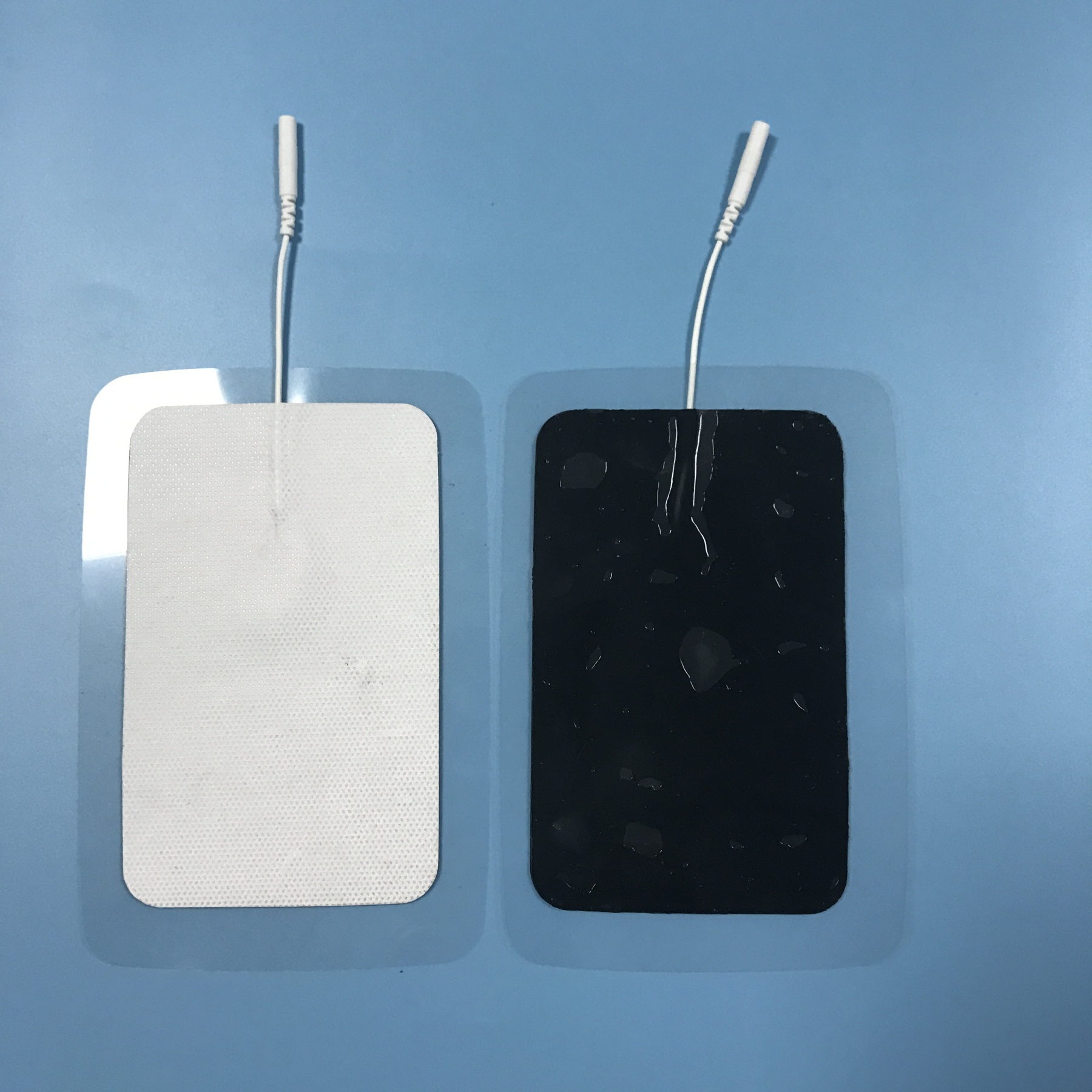 Wholesale 2.0/2.5mm tail fiber TENS, self-adhesive physical therapy, electrode pads for electrotherapy