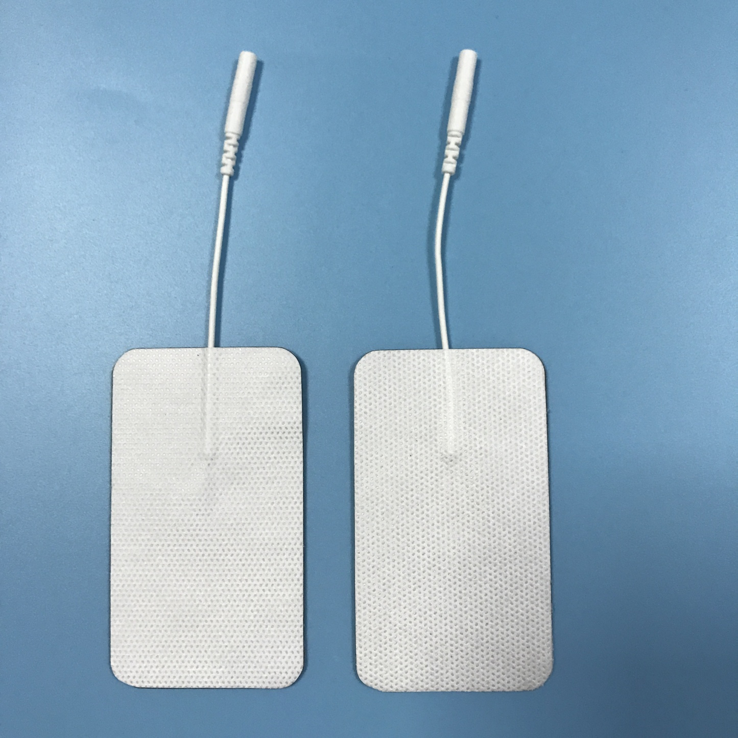 Wholesale 2.0/2.5mm tail fiber TENS, self-adhesive physical therapy, electrode pads for electrotherapy