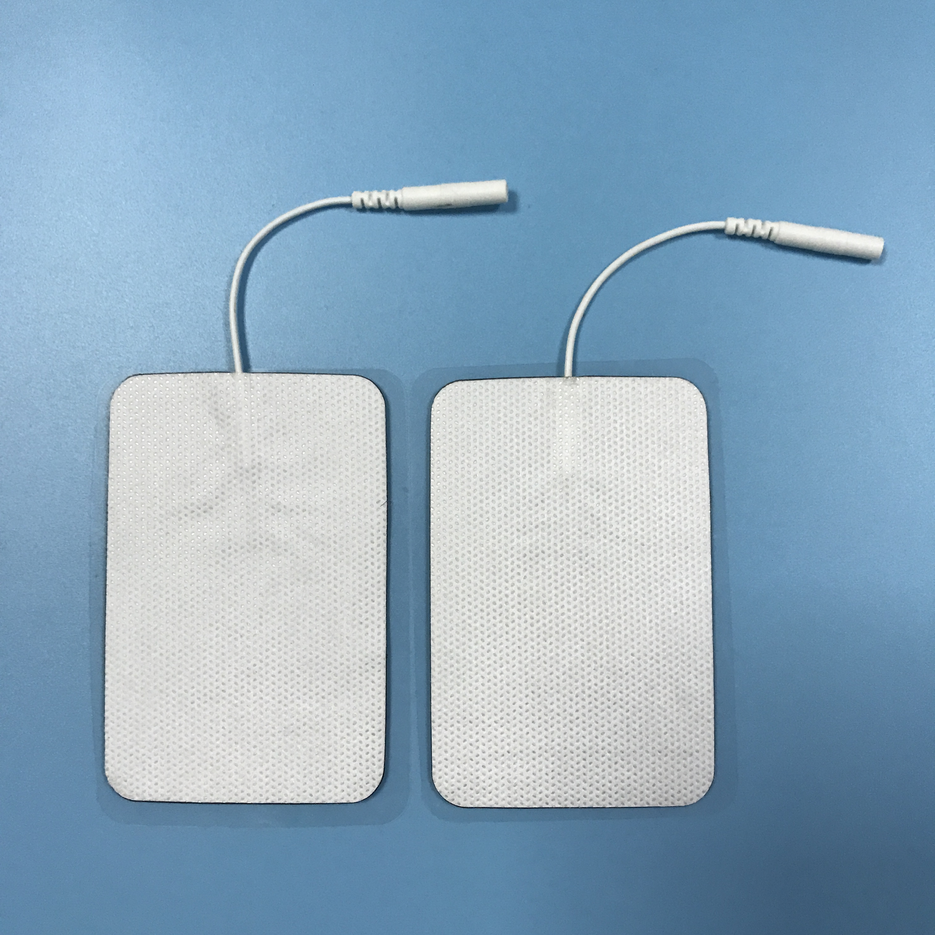 Wholesale 2.0/2.5mm tail fiber TENS, self-adhesive physical therapy, electrode pads for electrotherapy