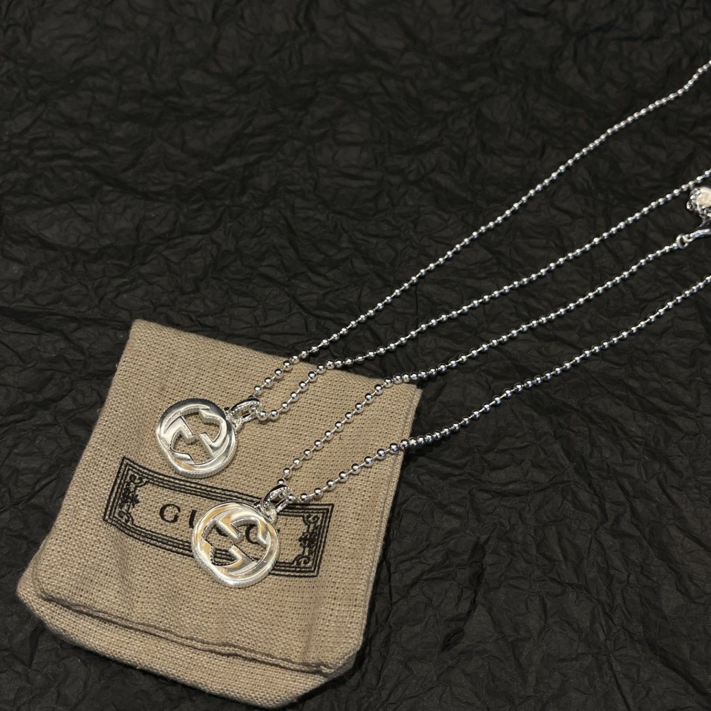 Gucci（グッチ）の interlocking のスモールサイズの玉型ビーズとダブル G のネックレス