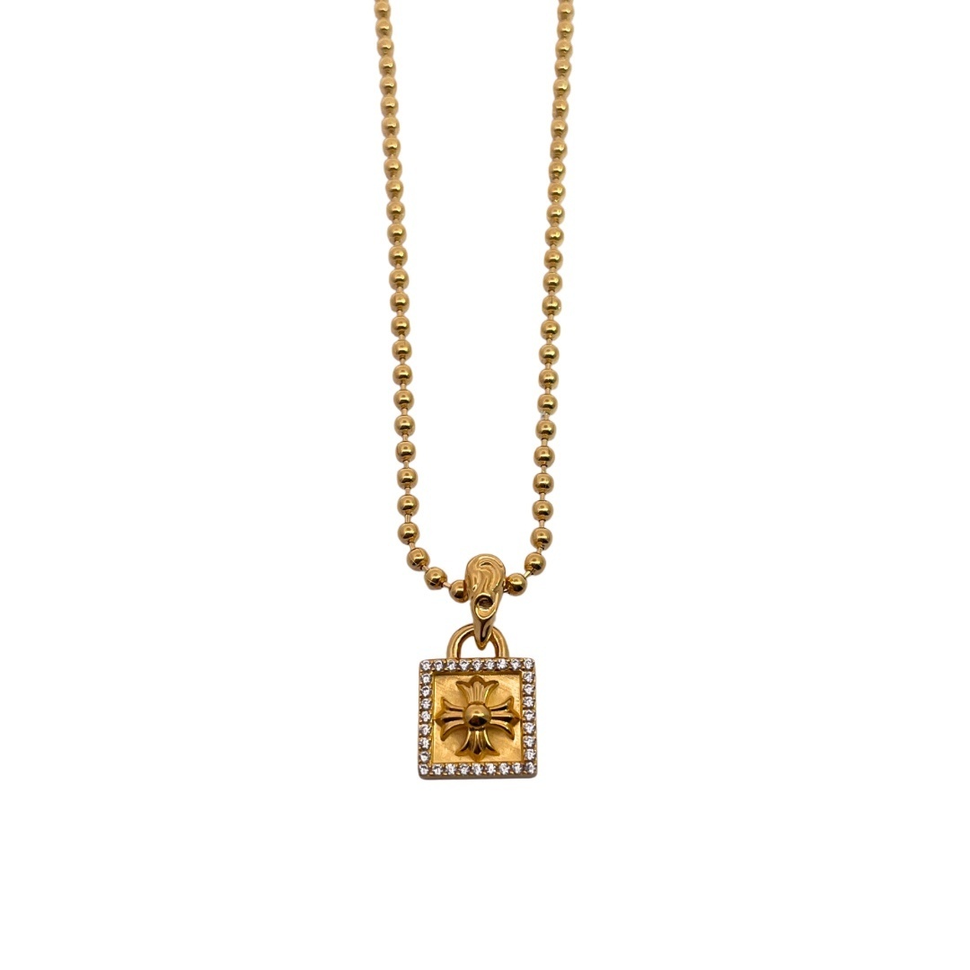 Chrome Hearts（クロム・ハーツ）の金メッキで全面に石を埋めたクロスフラワーの小さな四角形のタグ