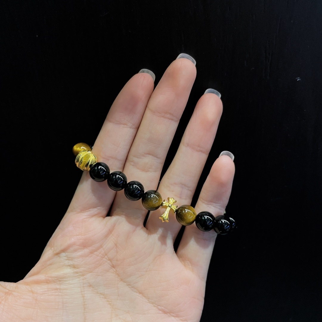 Chrome Hearts（クロム・ハーツ）のクロスモチーフの黒瑪瑙と琥珀石入りのハンドブレスレット