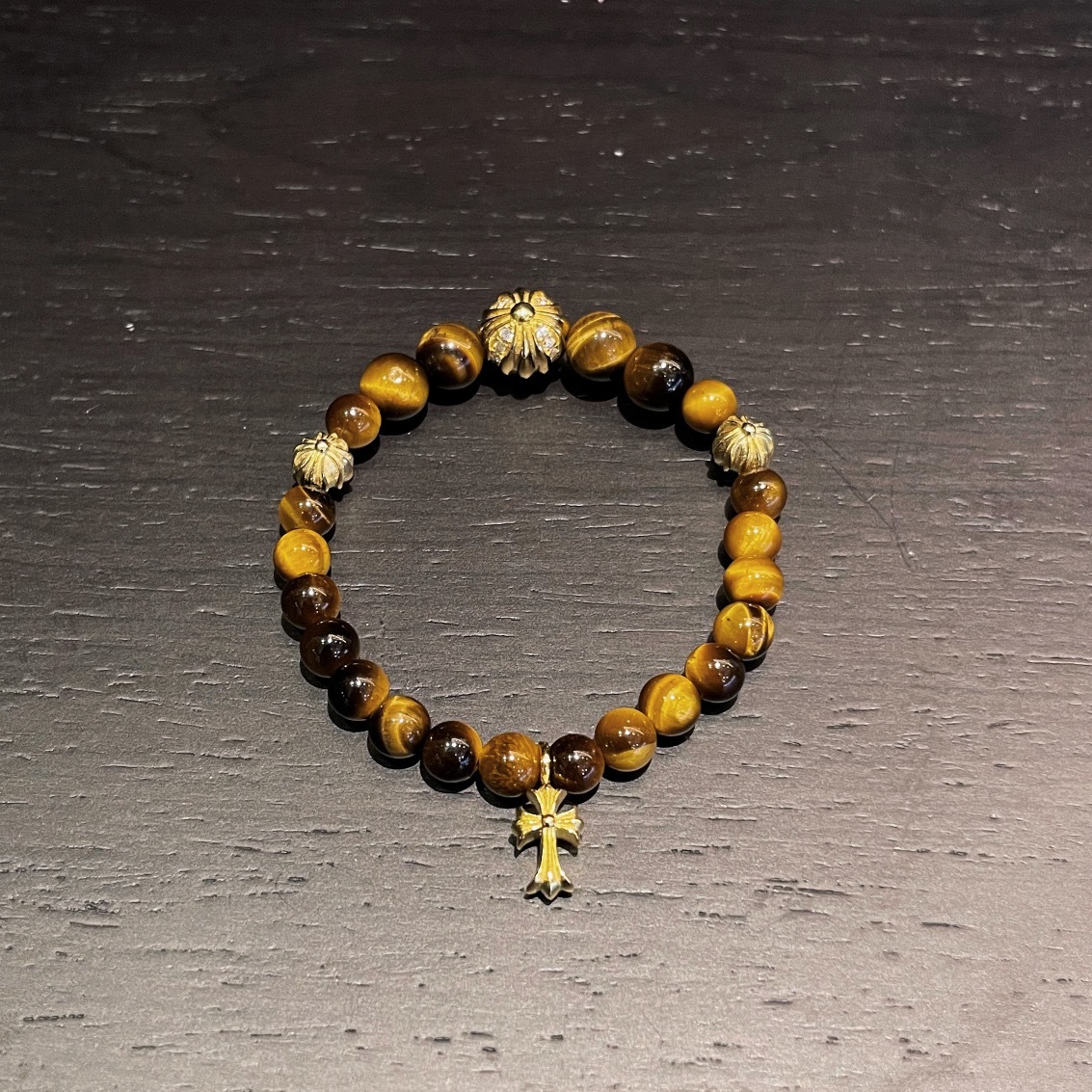 Chrome Hearts（クロム・ハーツ）のクロスモチーフの金メッキアンバー入りハンドブレスレット