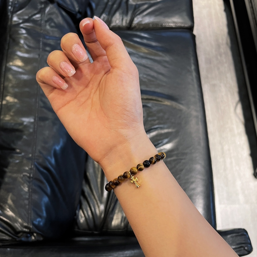 Chrome Hearts（クロム・ハーツ）のクロスモチーフの金メッキアンバー入りハンドブレスレット