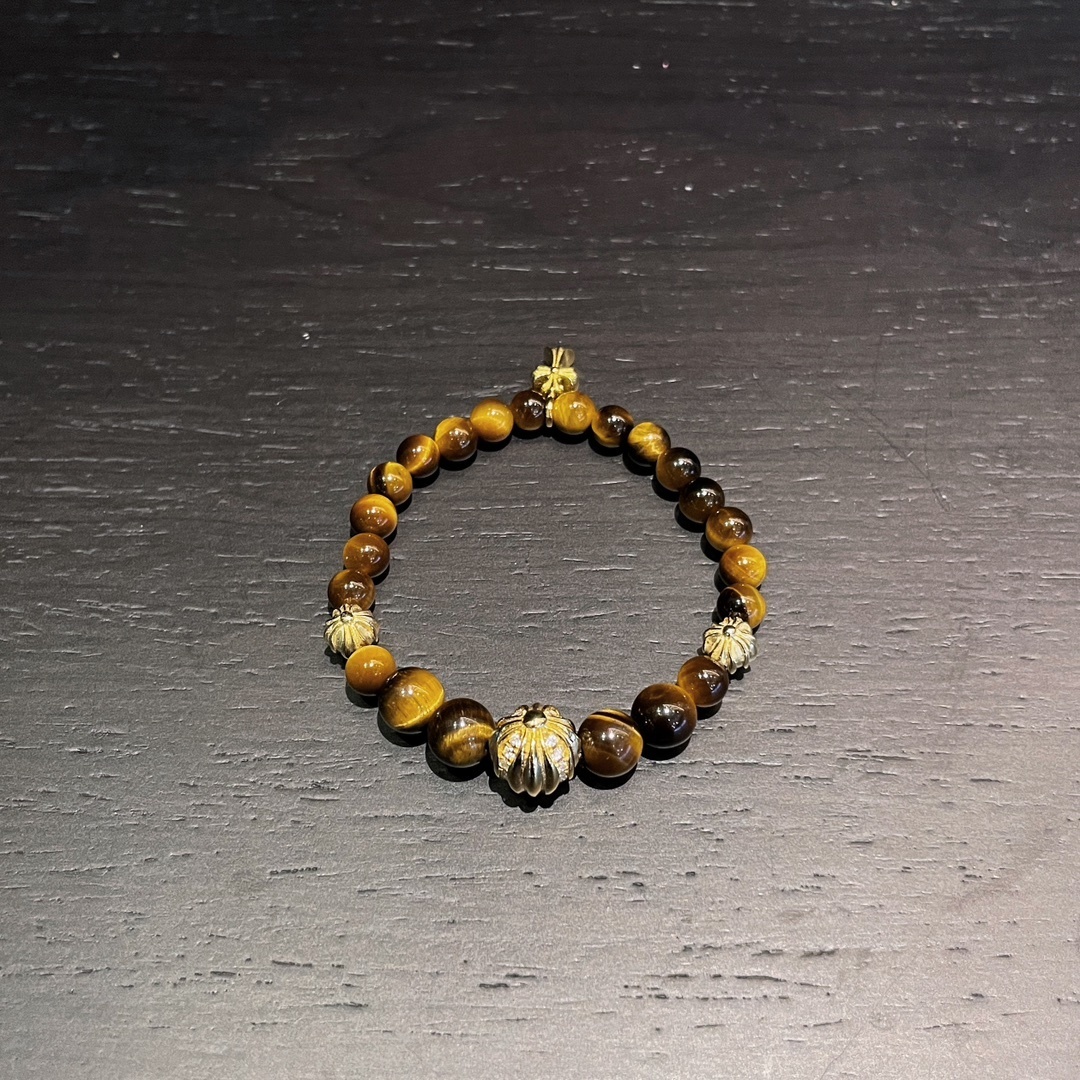 Chrome Hearts（クロム・ハーツ）のクロスモチーフの金メッキアンバー入りハンドブレスレット