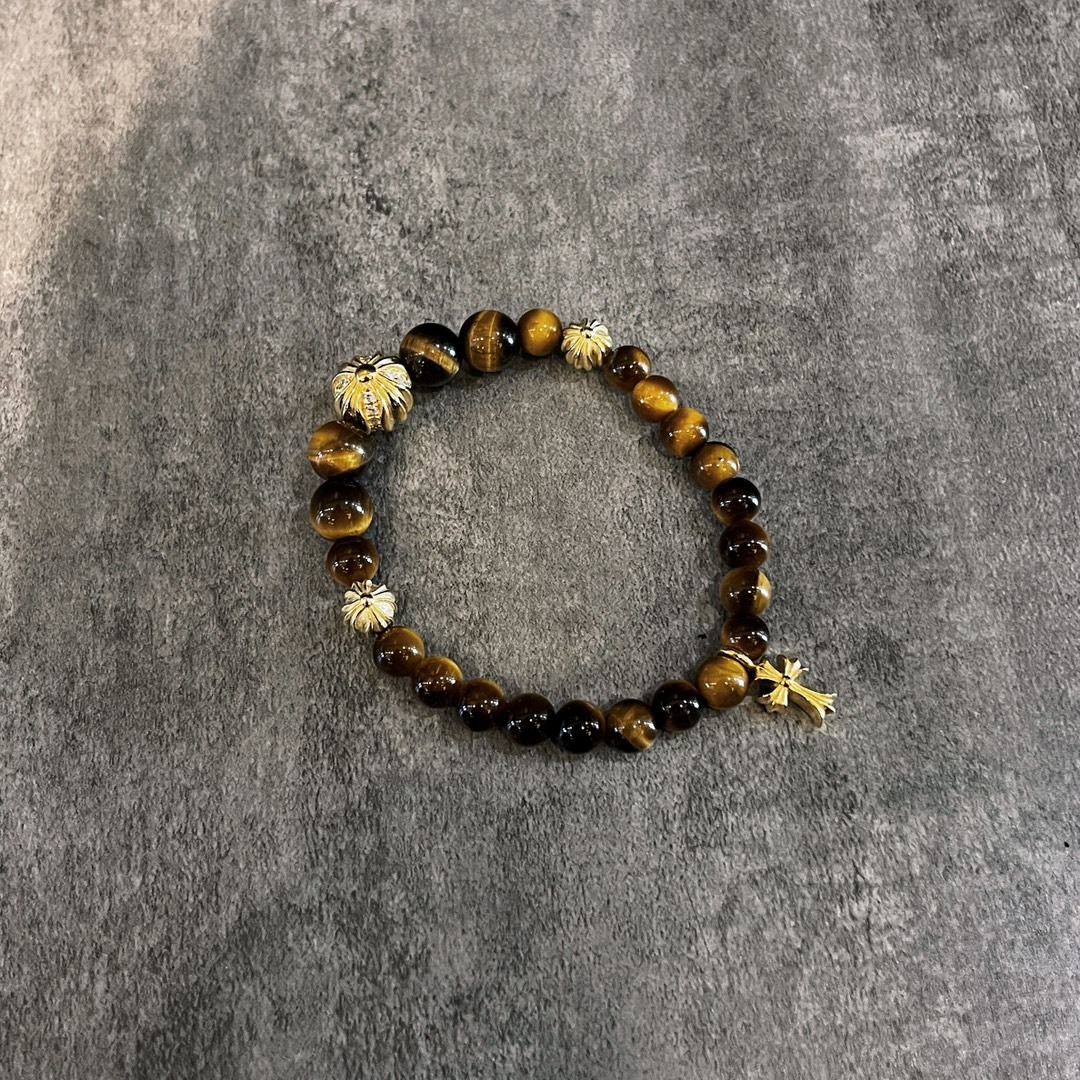 Chrome Hearts（クロム・ハーツ）のクロスモチーフの金メッキアンバー入りハンドブレスレット