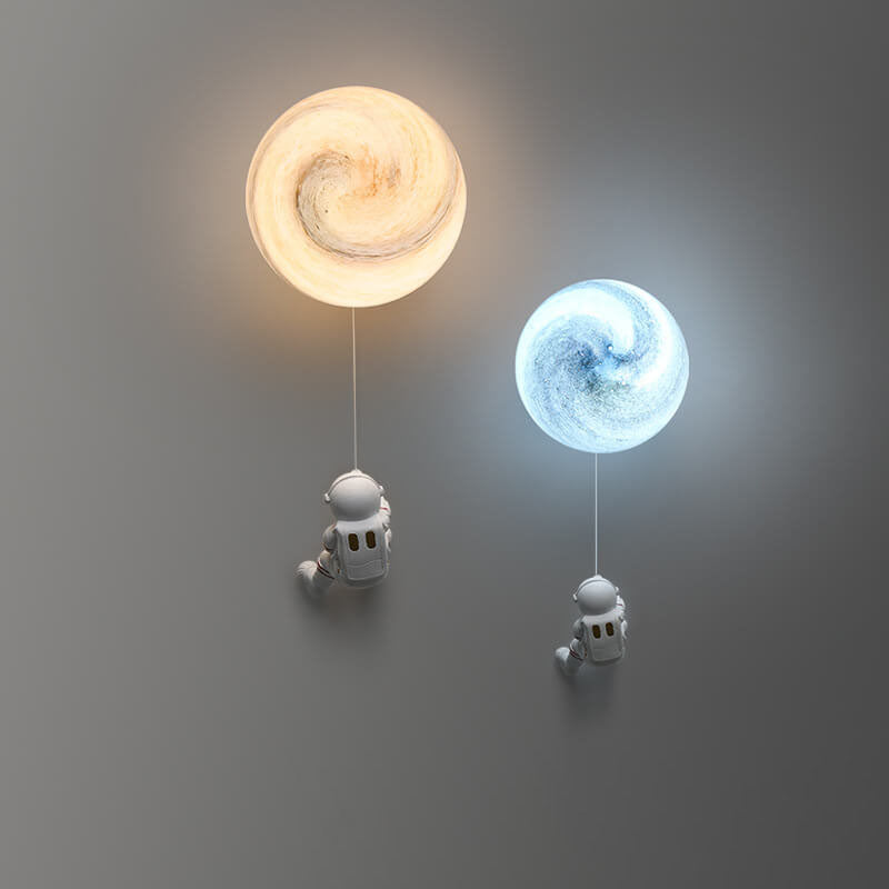 Contemporary Orb Astronaut Iron Resin Sconce