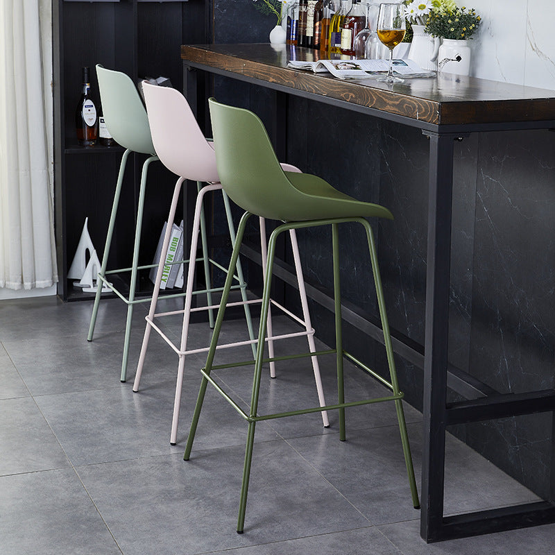 Minimalist curved green bar & counter stools in metal fabric