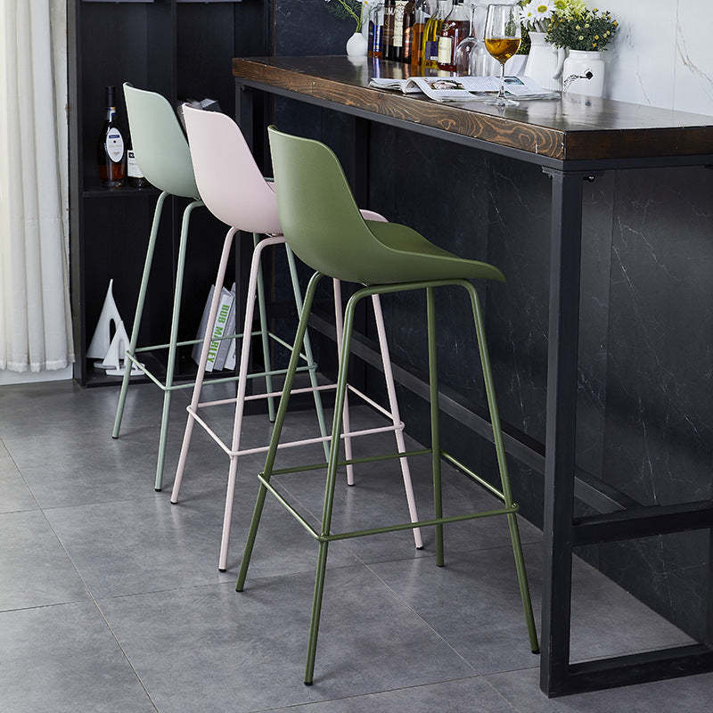 Minimalist curved green bar & counter stools in metal fabric