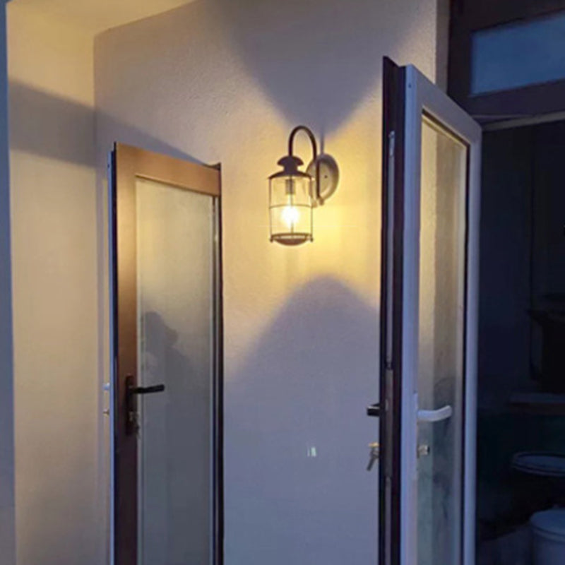 Contemporary Iron Frame Glass Cylinder Outdoor Wall Sconce