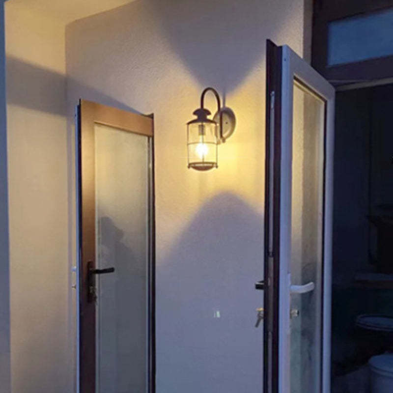 Contemporary Iron Frame Glass Cylinder Outdoor Wall Sconce