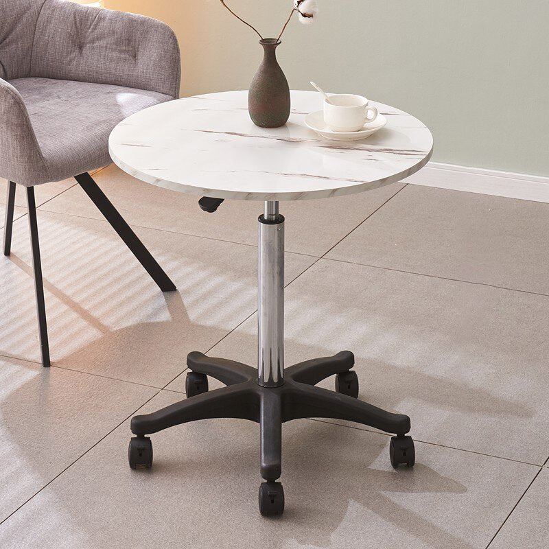Minimalist round liftable coffee tables in metal marble