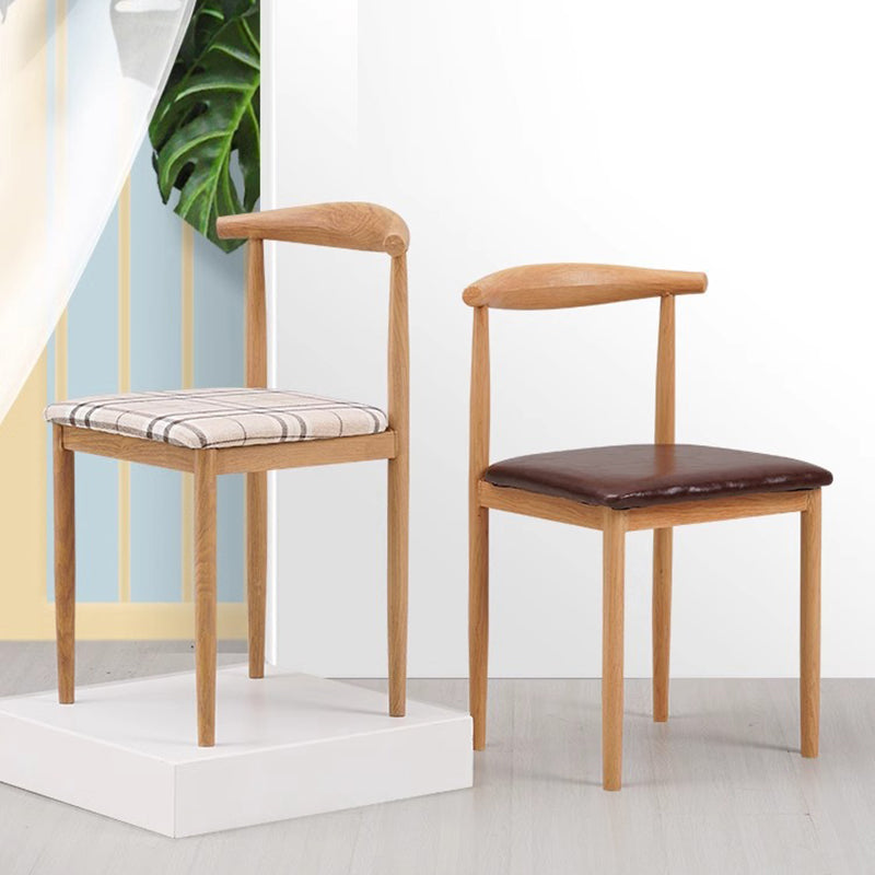 Minimalist Leather Carbon Steel Dining Chair — A - Black