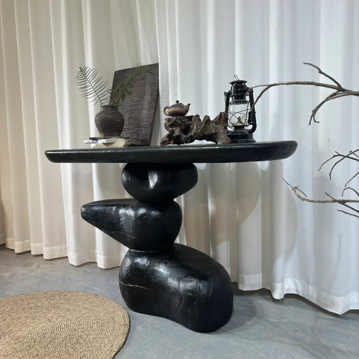 Artistic Pebble Base Black Wood Console Table