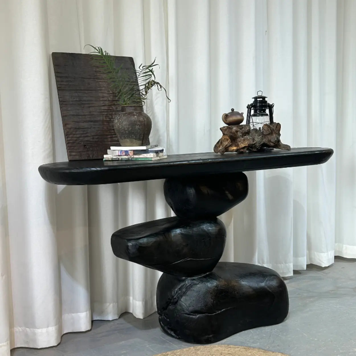 Artistic Pebble Base Black Wood Console Table