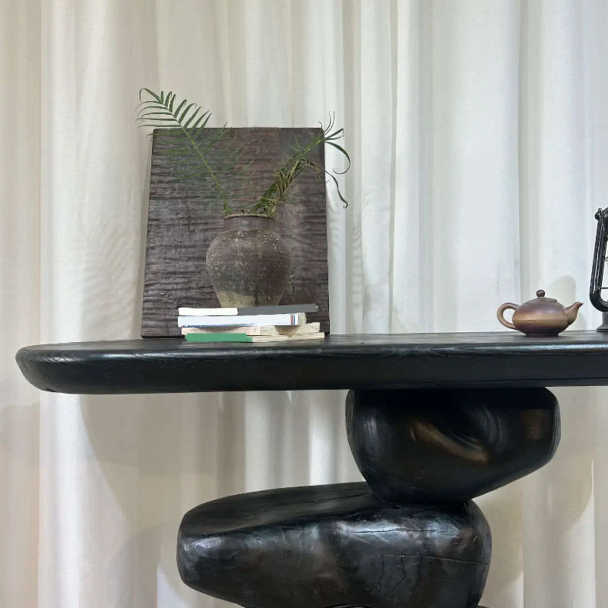 Artistic Pebble Base Black Wood Console Table