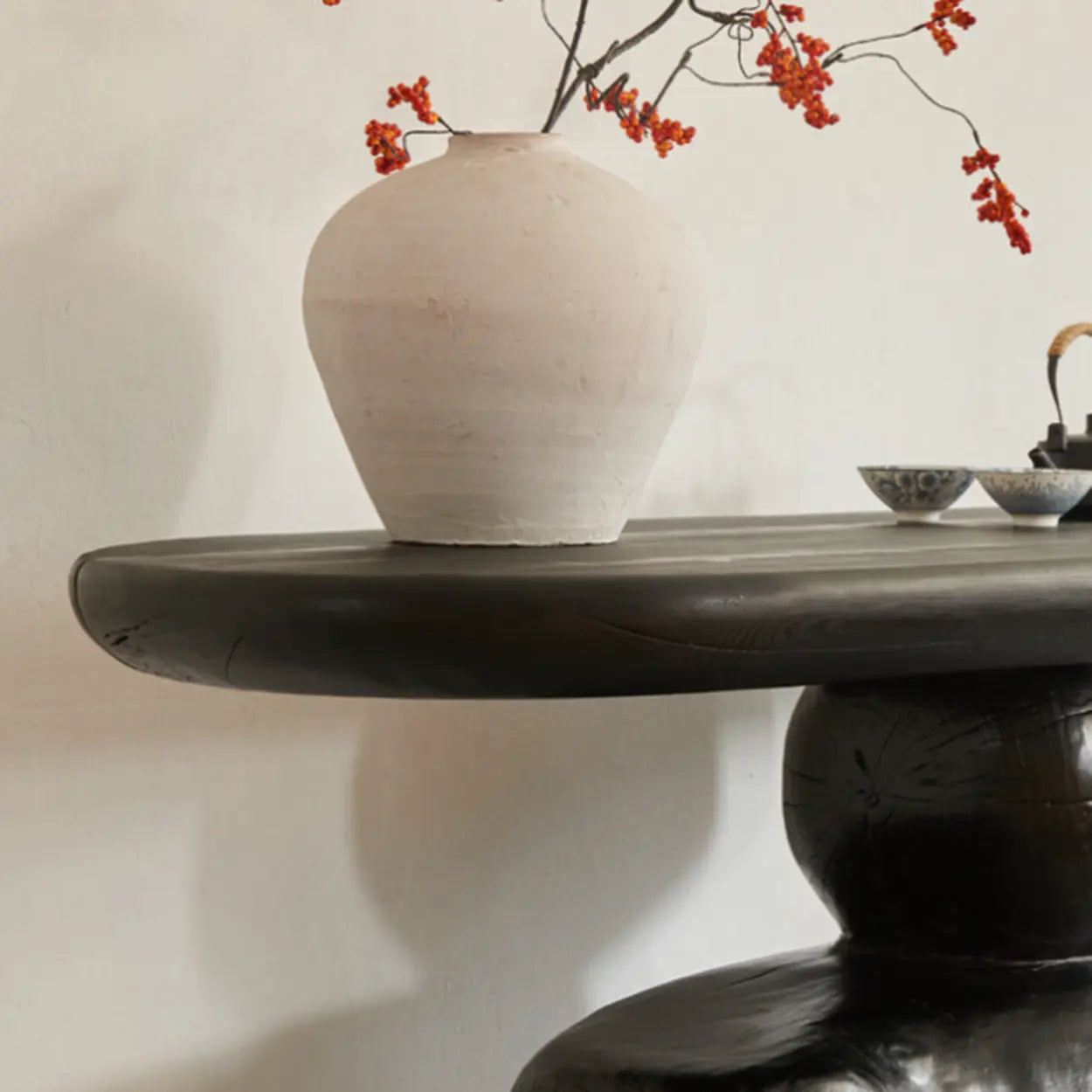 Artistic Pebble Base Black Wood Console Table