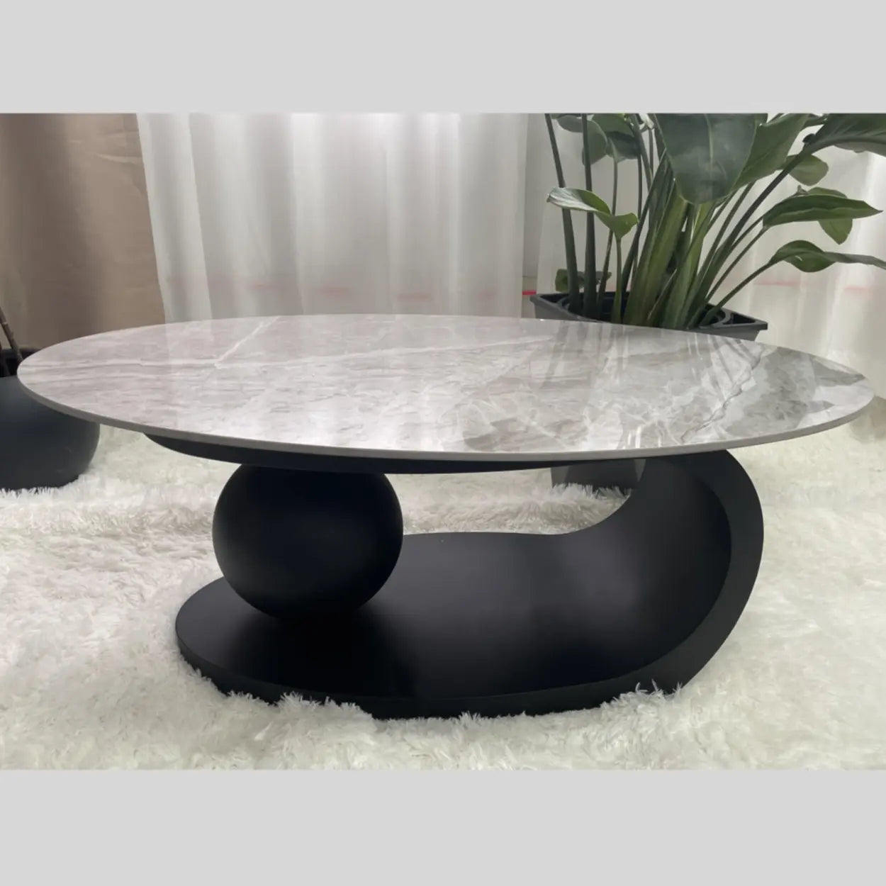Stone-Top Coffee Table with Abstract Metal Base — Black