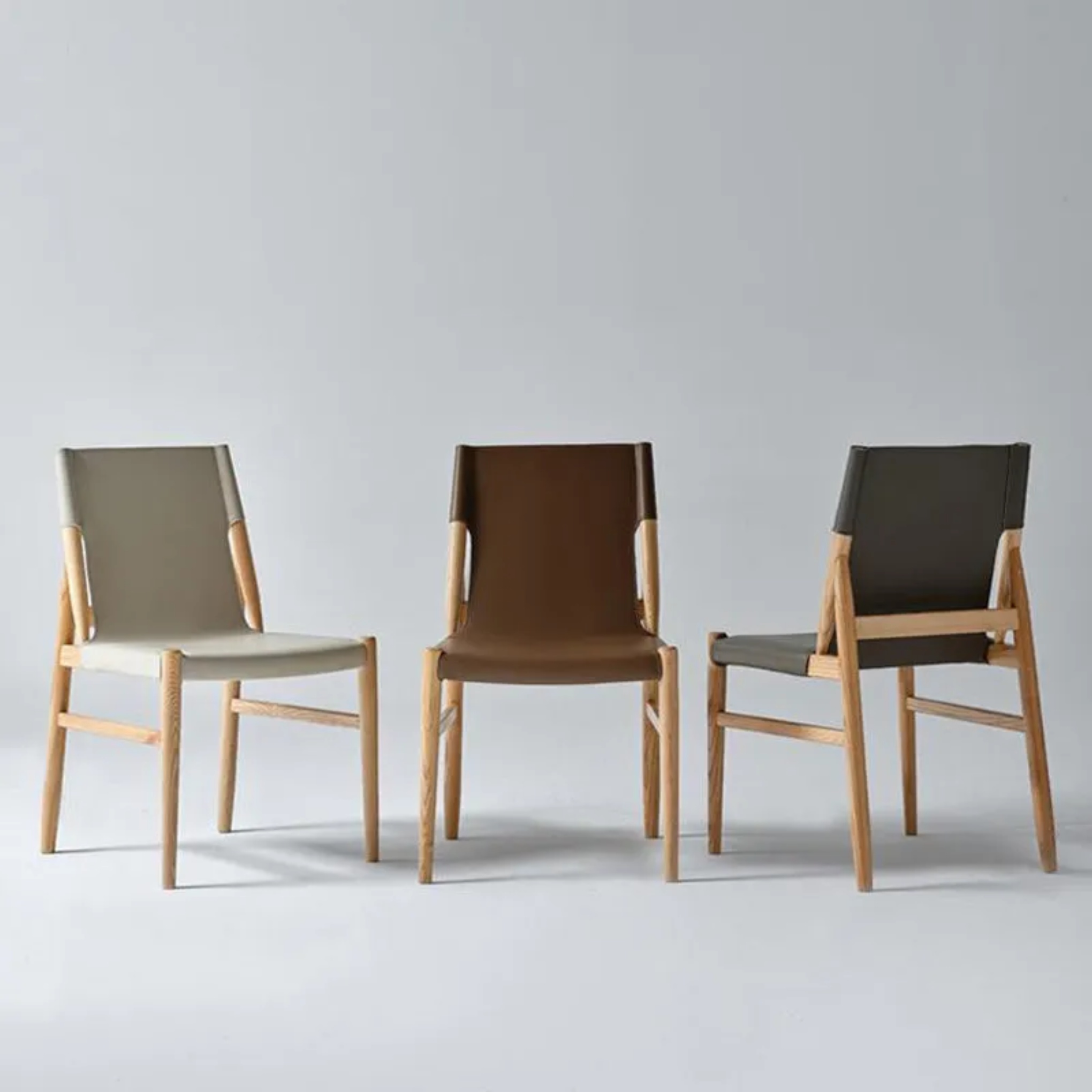Minimalist saddle black dining chairs & benches in leather