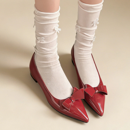 リボンモチーフ エナメルパンプス