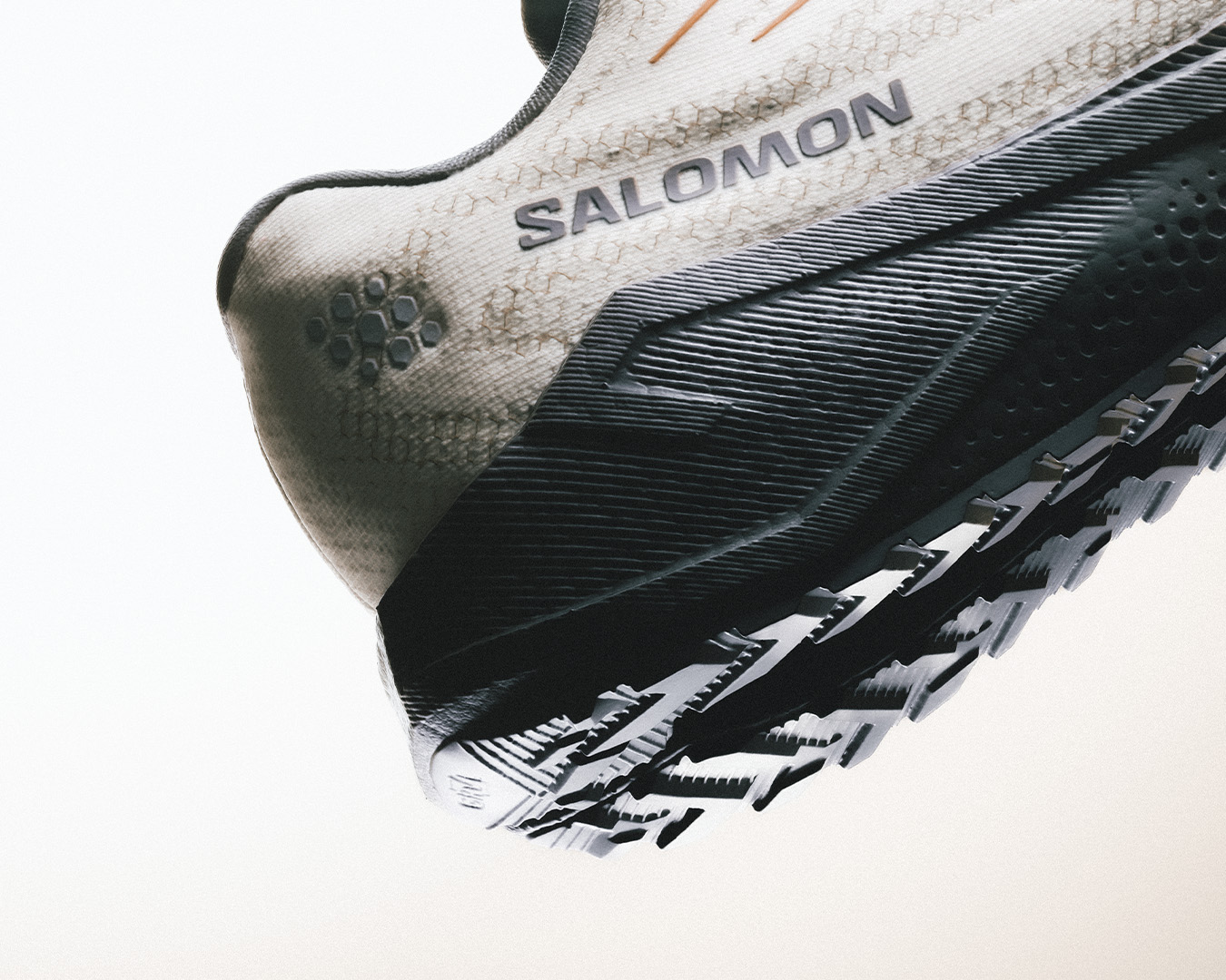 Salomon gravel shoes in motion on a sunlit gravel route