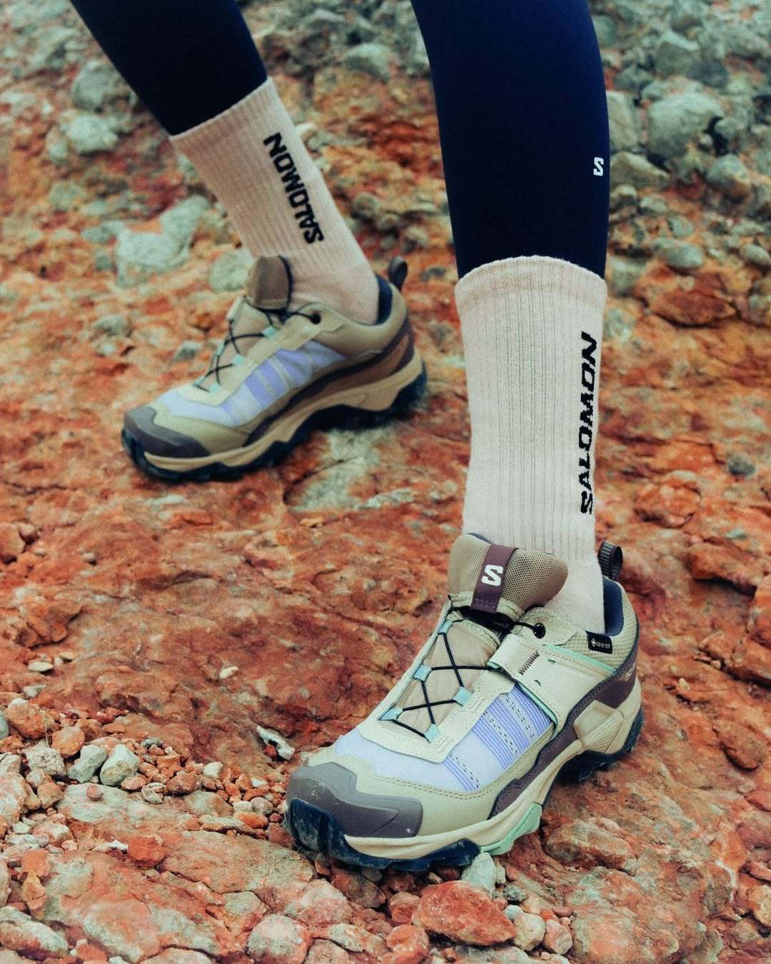 Close-up of Salomon X Ultra shoes on rocky terrain