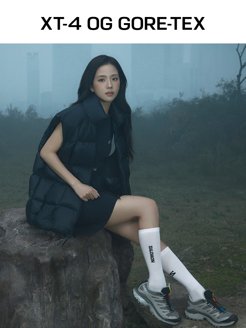 JISOO wearing XT-4 OG GORE-TEX in a misty outdoor landscape