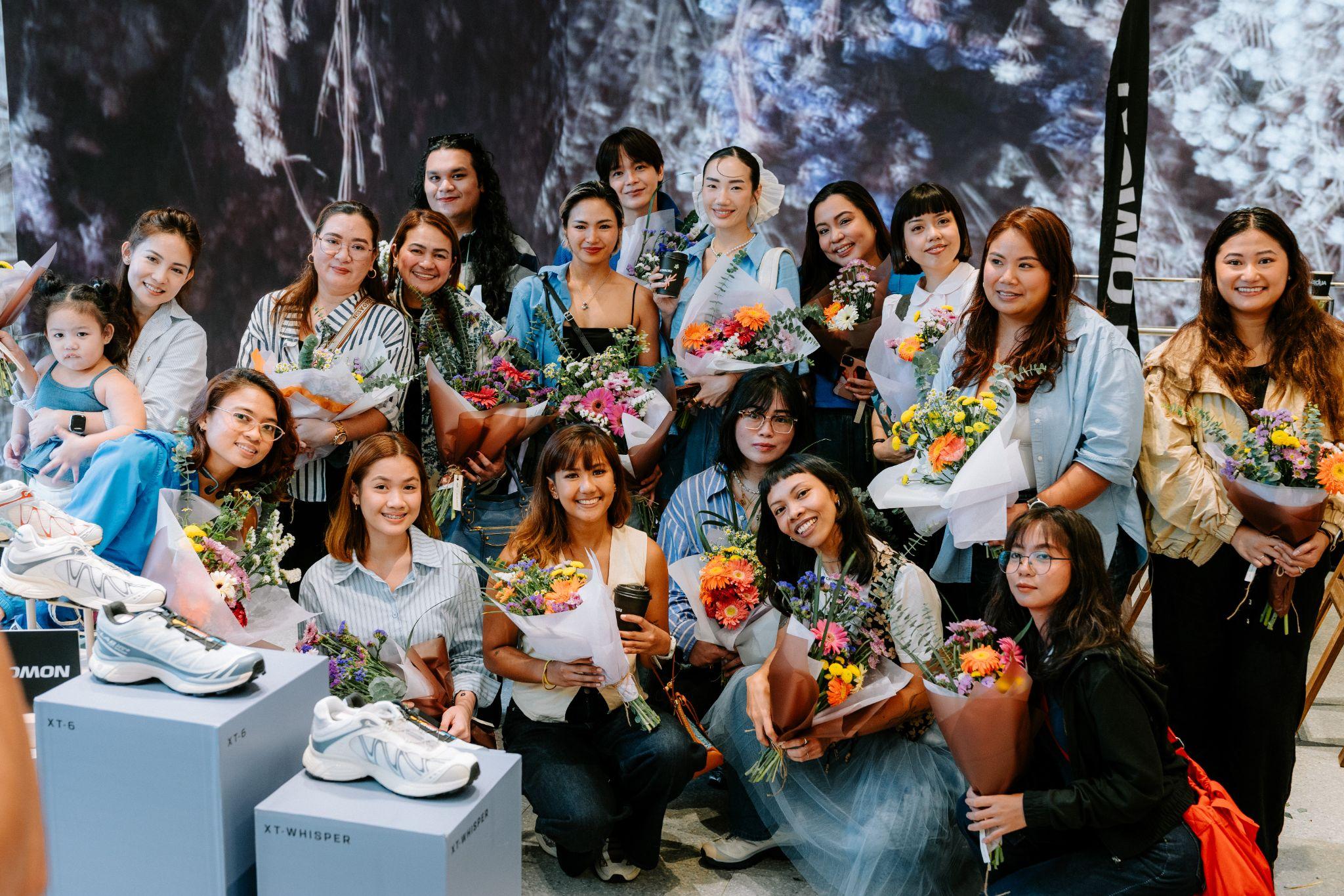 Salomon XT-ICONS FORMS collection displayed among natural materials and florals