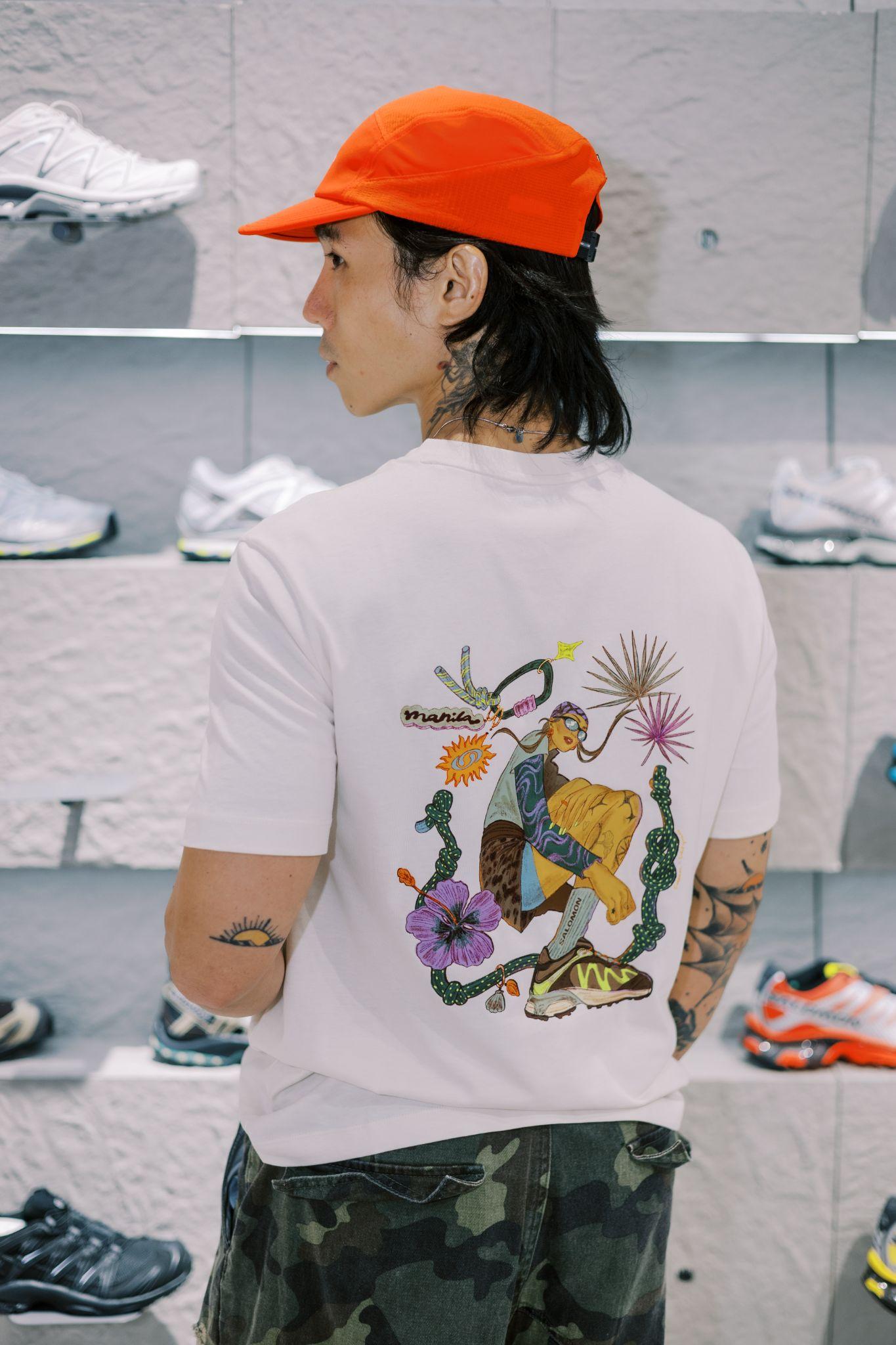 Content creator Jeff Ong wearing the limited Salomon Manila logo tee designed by Soleil Ignacio