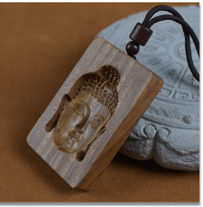 Green Sandalwood Intaglio-Carved Buddha Head Pendant