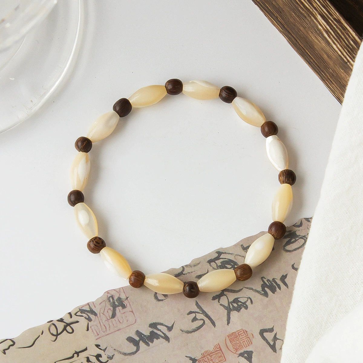 Artisanal Shell and Wooden Bead Bracelet-attracting good fortune, warding off negativity, and fostering harmony