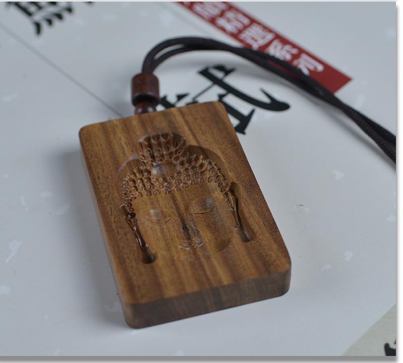 Green Sandalwood Intaglio-Carved Buddha Head Pendant