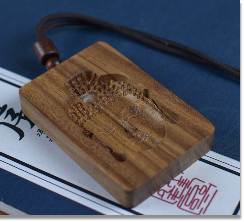 Green Sandalwood Intaglio-Carved Buddha Head Pendant