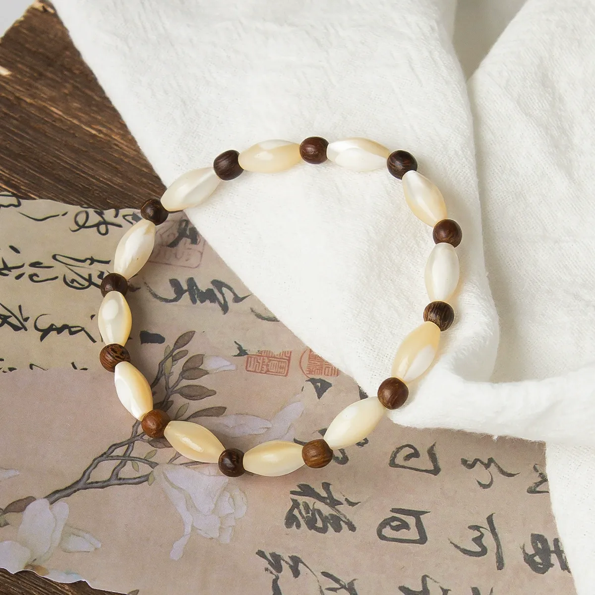 Artisanal Shell and Wooden Bead Bracelet-attracting good fortune, warding off negativity, and fostering harmony