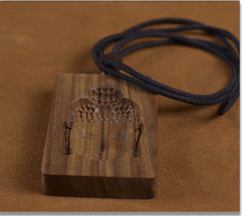 Green Sandalwood Intaglio-Carved Buddha Head Pendant