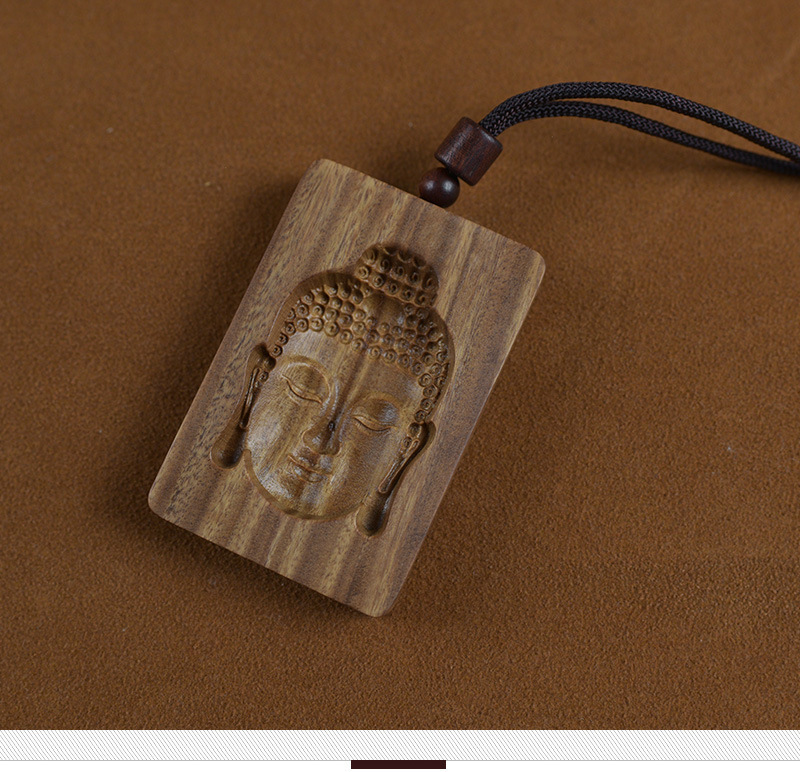 Green Sandalwood Intaglio-Carved Buddha Head Pendant