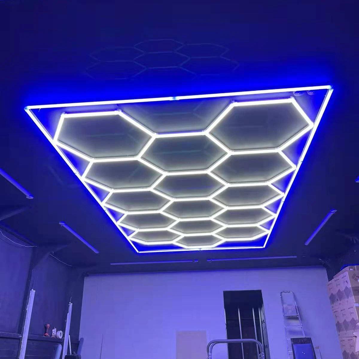 Bright hexagon LED light with blue edging enhancing garage workspace
