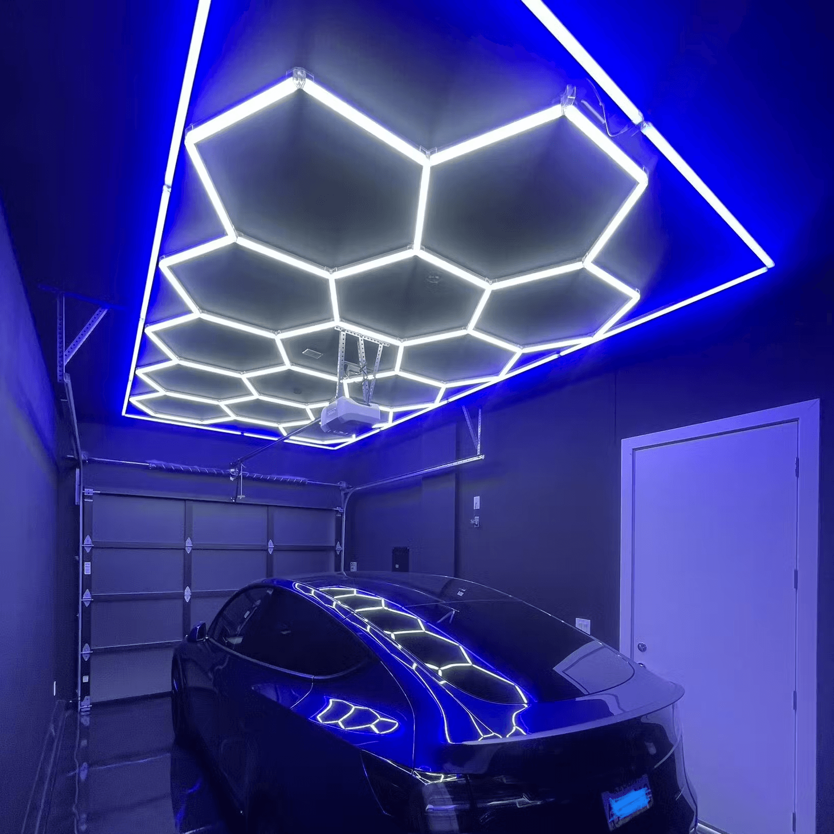 Blue bordered hexagon LED light illuminating spacious garage area