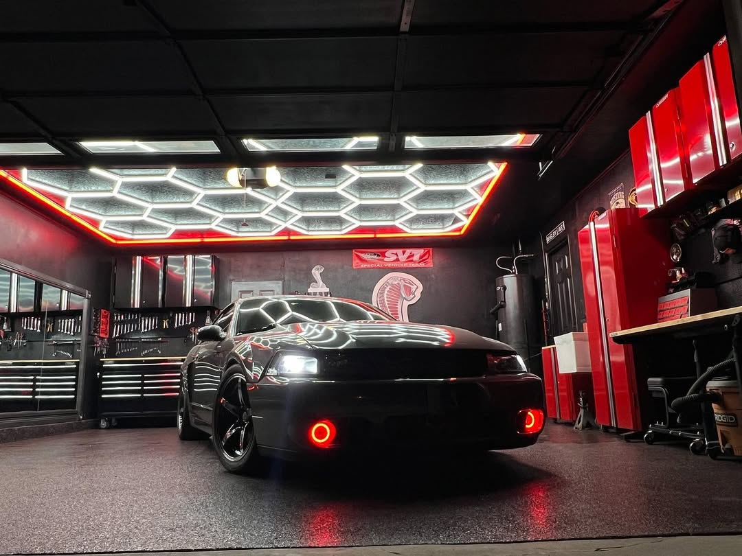 Red framed hexagon LED lighting for professional car modification workshop