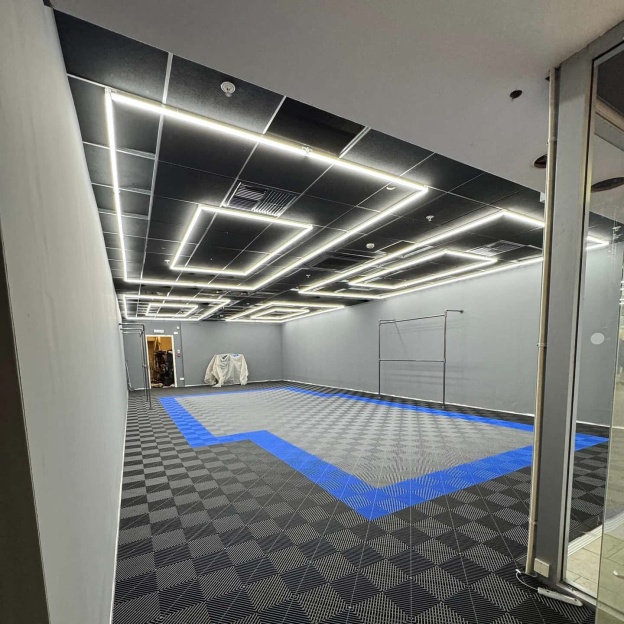 Rectangle LED ceiling light illuminating exhibition space
