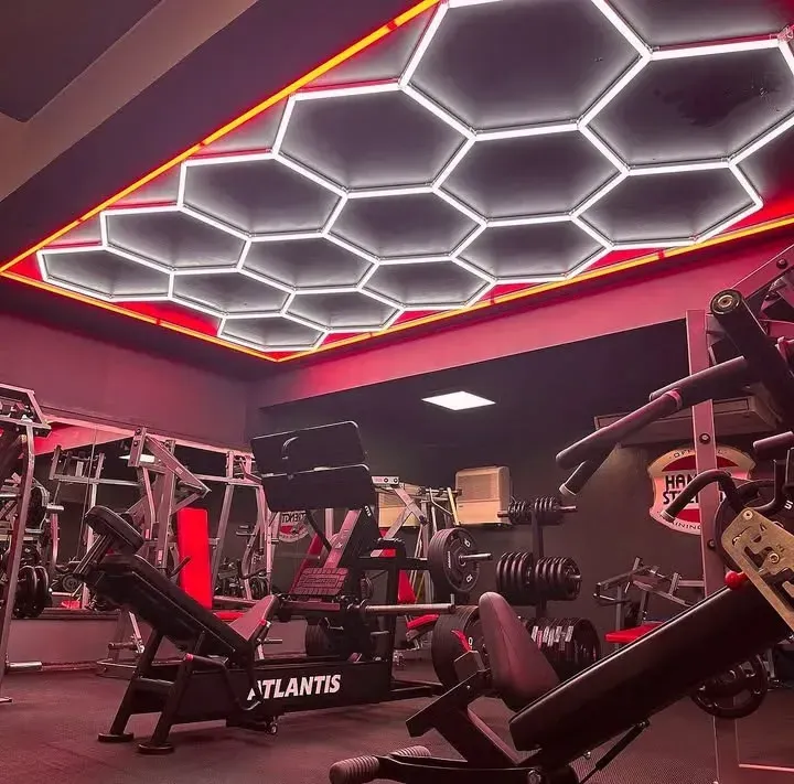 Honeycomb LED lighting with red frame enhancing workout space